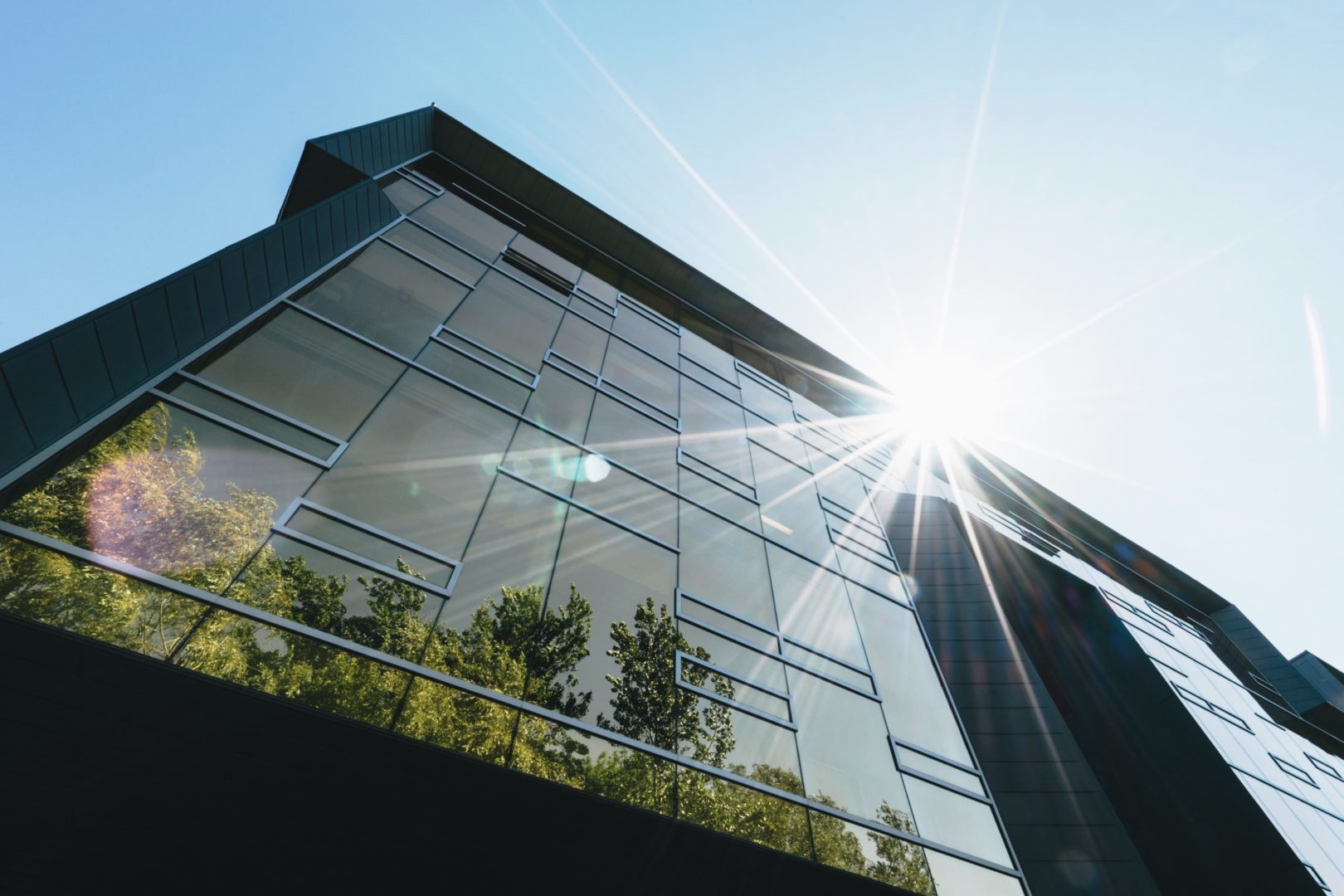 building illuminated with sunlight viewed from the bottom